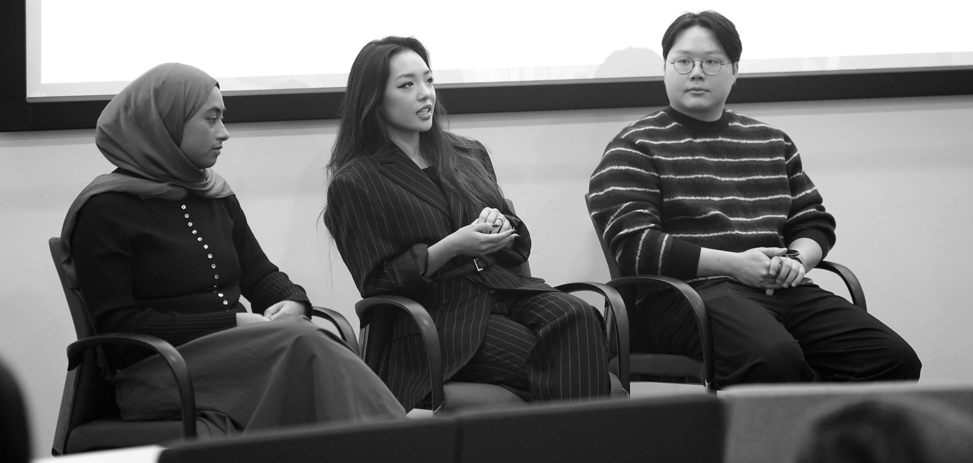 Nhi Pm speaking on a panel at UCL